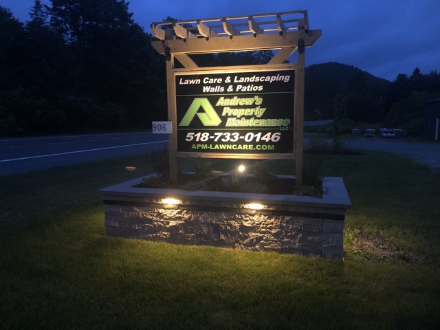 APM Company Sign at Night
